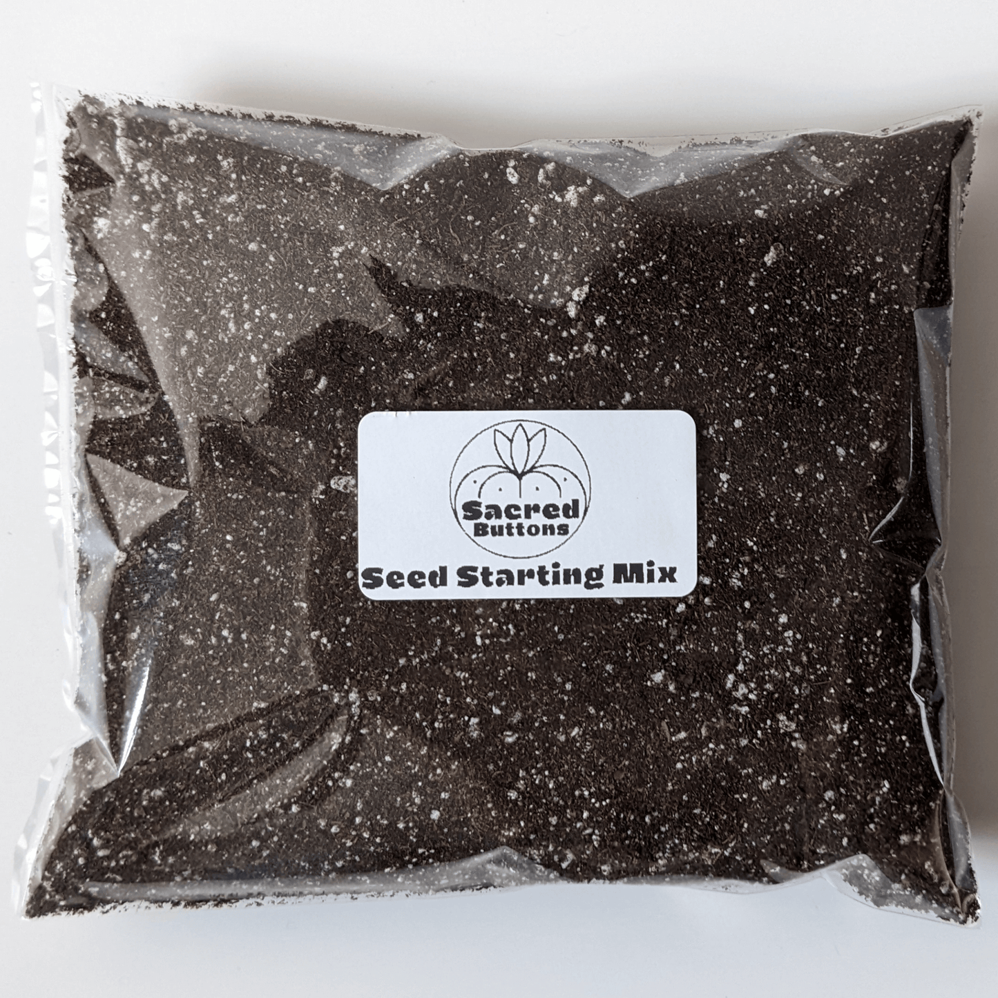 A bag of Sacred Buttons seed starting mix.
