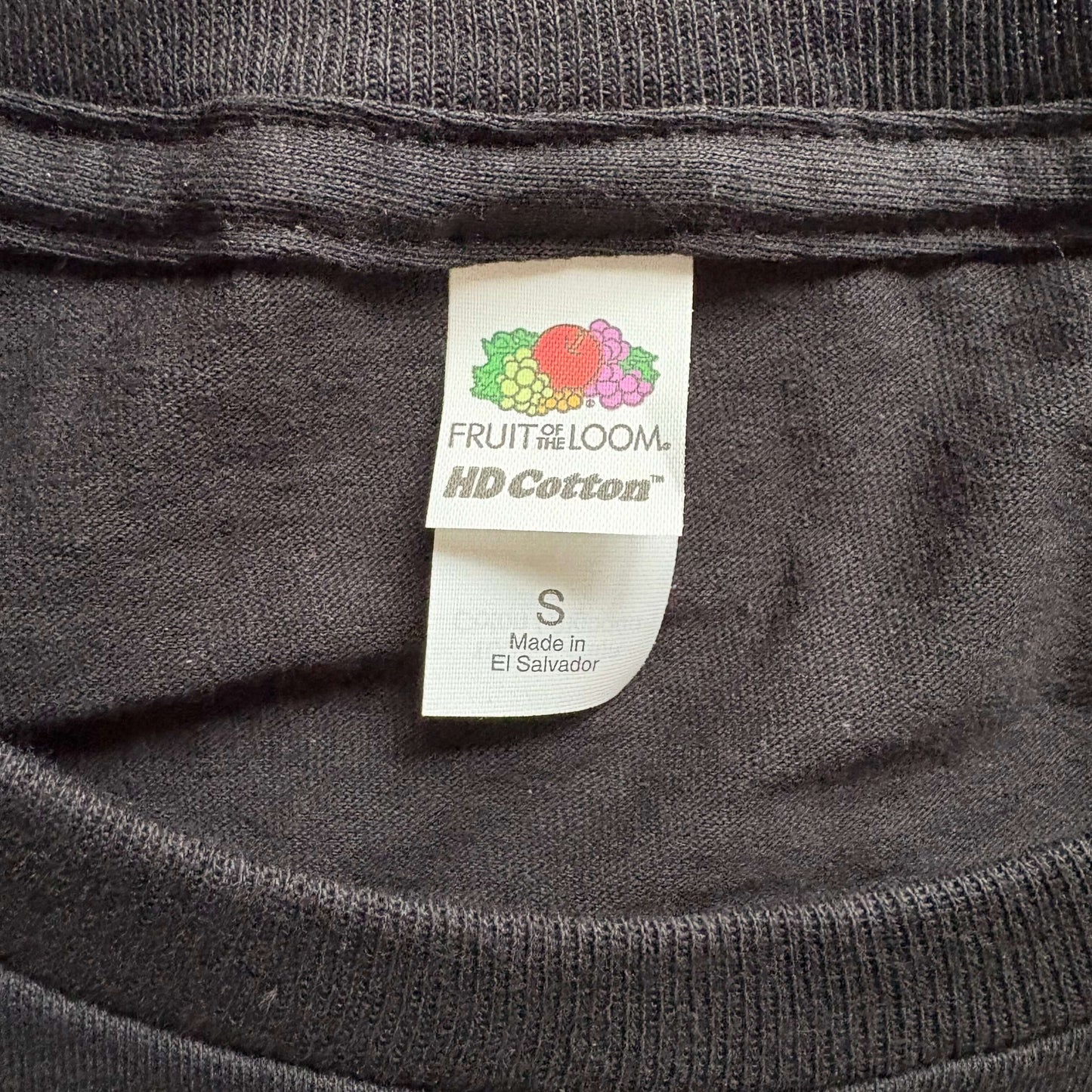 A t-shirt tag showing the brand and size.