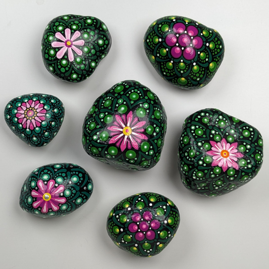 Stones for your garden that are painted to look like peyote cacti.