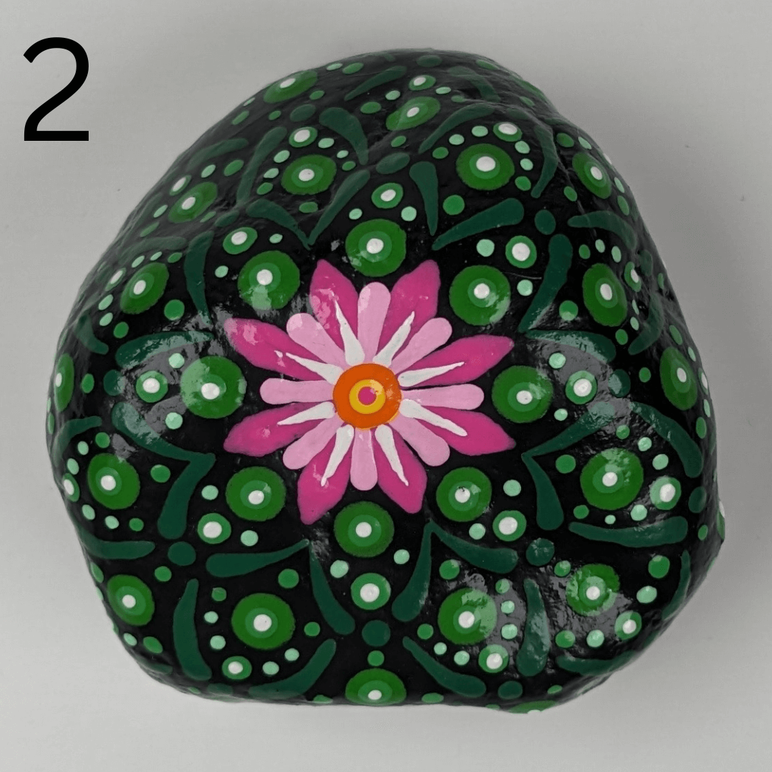 A stone for your garden that is painted to look like a peyote cactus.