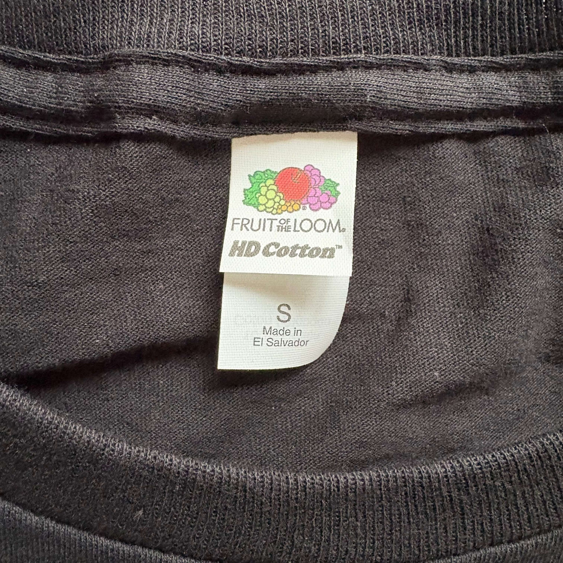 A t-shirt tag showing the brand and size.