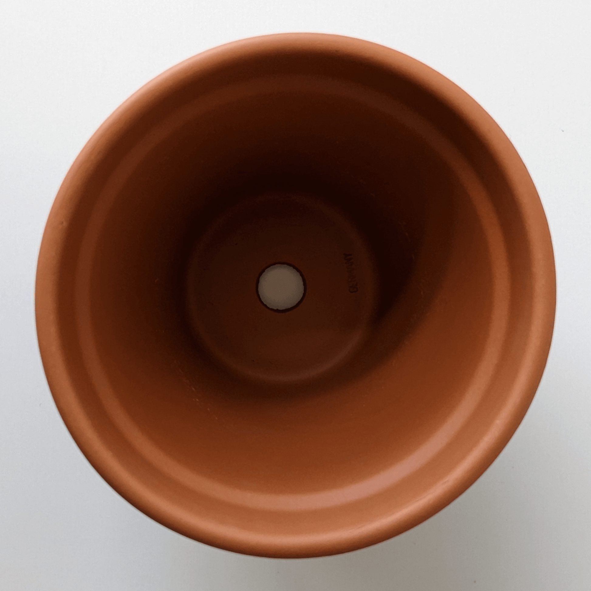 A clay pot viewed from the top.