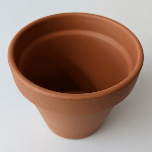 A clay pot viewed from the side.